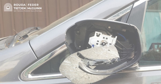 a car with a broken side-view mirror